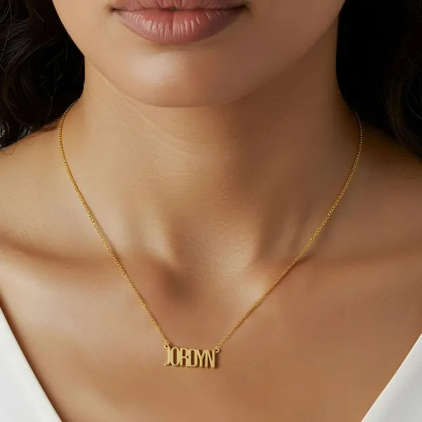 14 karat thin letter name necklace in yellow gold