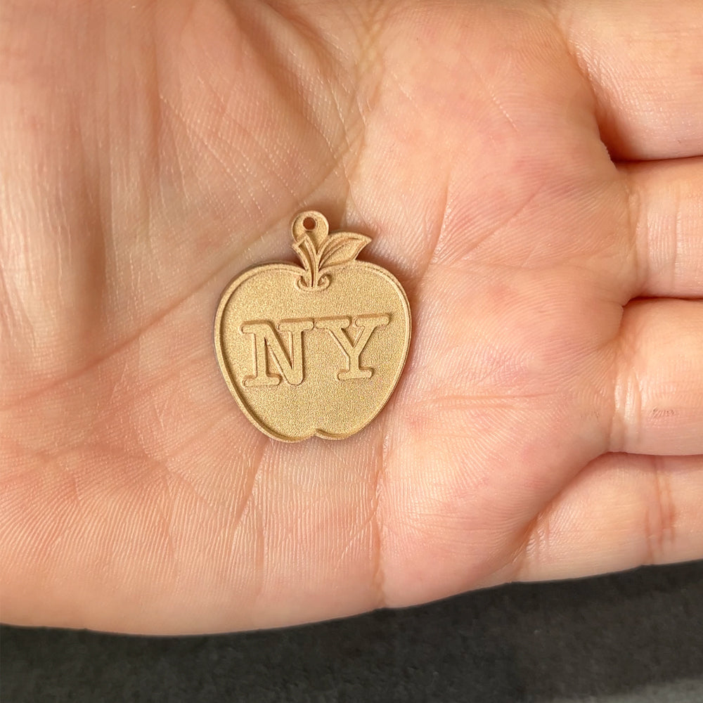 The raw, unfinished product of the Custom NY Apple Pendant