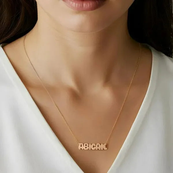 Abigail 14K Bubble Letter Name Necklace lifestyle shot in Rose Gold