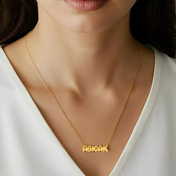 Abigail wearing 14K Yellow Gold Bubble Letter Name Necklace