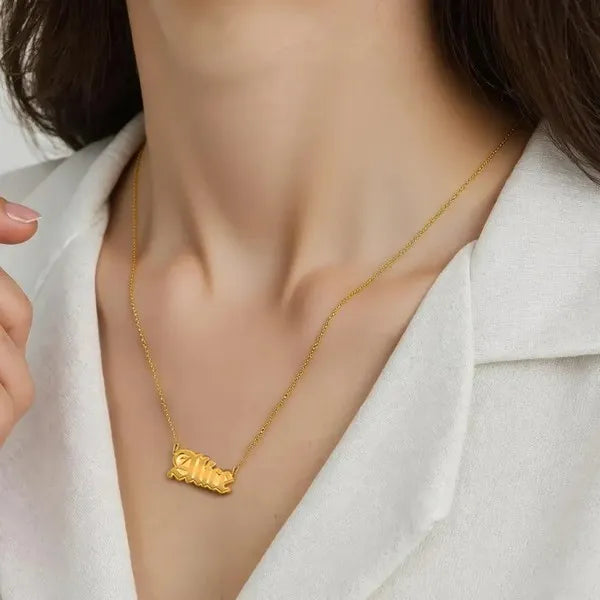 Alice name necklace worn in 14k yellow gold