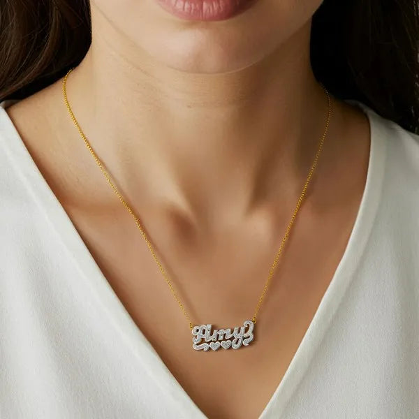 Amy name necklace worn in 14k yellow gold