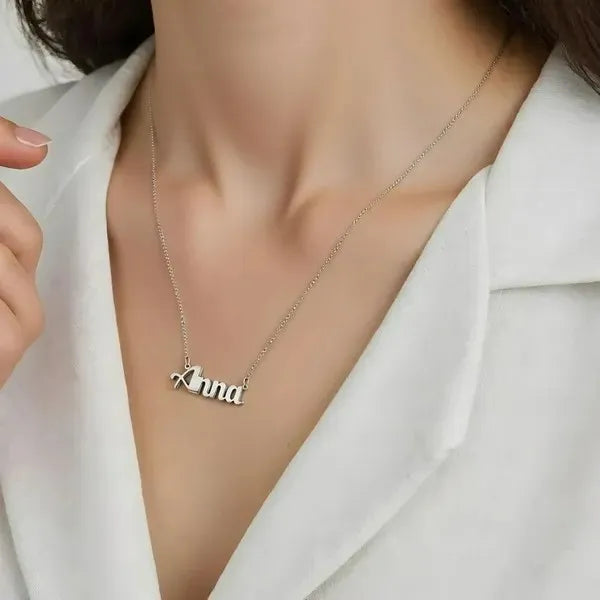 Model wearing anna 14k white gold bold name necklace
