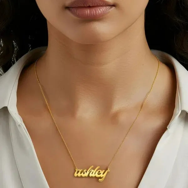 Model showcasing Ashley bold letter name necklace yellow gold