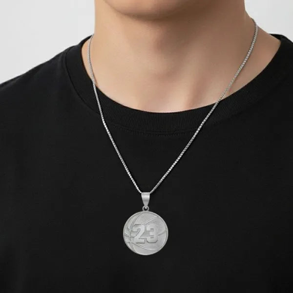 Basketball charm pendant worn by teen in sterling silver