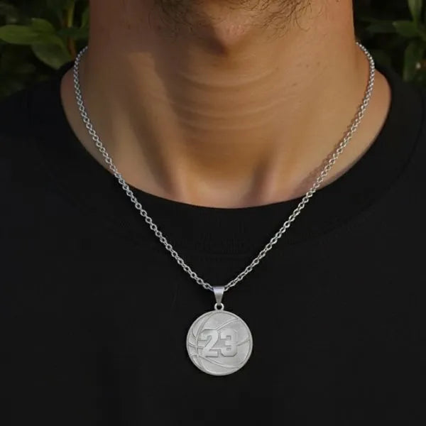 Basketball charm pendant worn by man in sterling silver                                                                                                                                                               