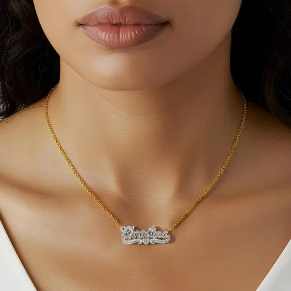 Christina name necklace worn in 14k yellow gold