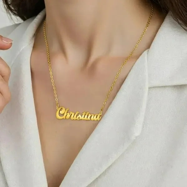 Model showcasing solid letter name necklace yellow gold