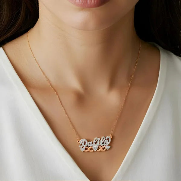 Rose gold Dalila name necklace worn on model