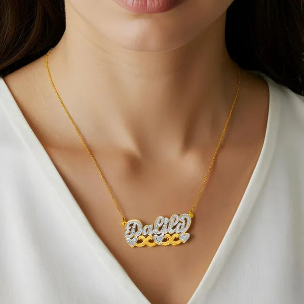 Dalila name necklace worn in 14k yellow gold