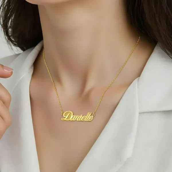 Model showcasing Danielle fancy script name necklace yellow gold