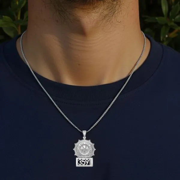 White gold detective badge pendant worn by man