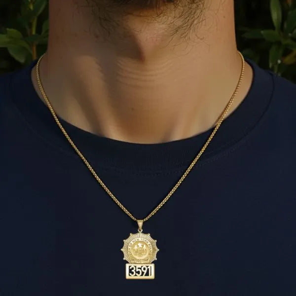 Detective badge pendant worn by man in yellow gold