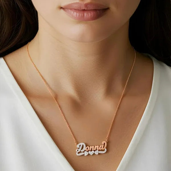 Rose gold Donna name necklace worn on model