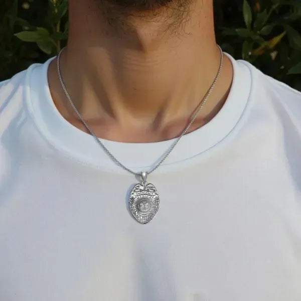 EMT badge charm pendant worn by man in sterling silver
