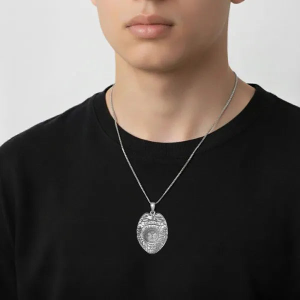 EMT badge charm pendant worn by teen in sterling silver
