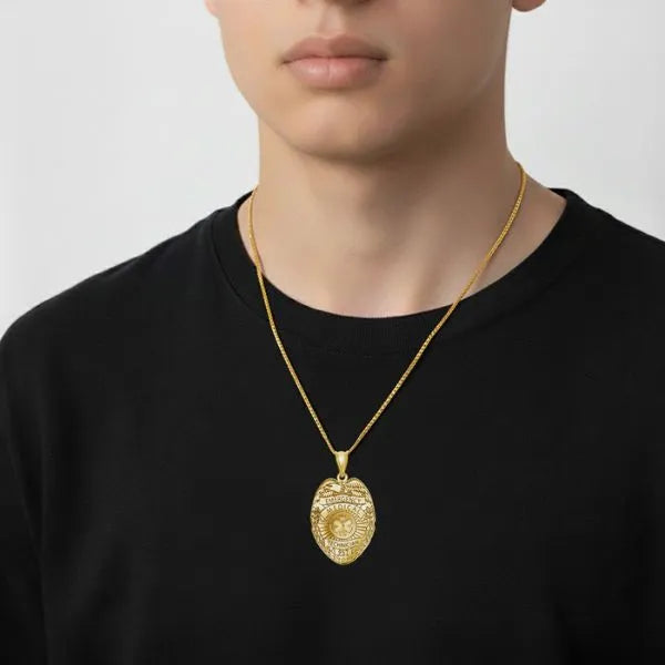 EMT badge pendant worn by teen in yellow gold