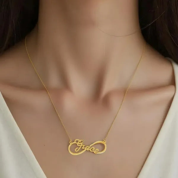 Grace infinity name necklace worn in 14k yellow gold