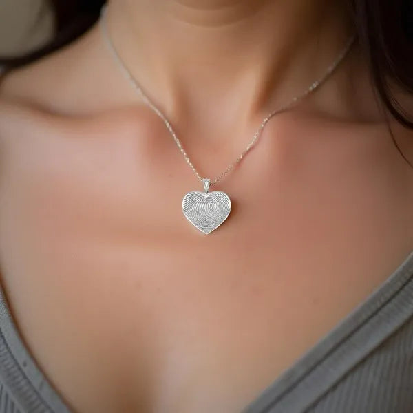 Heart fingerprint charm pendant worn in sterling silver
