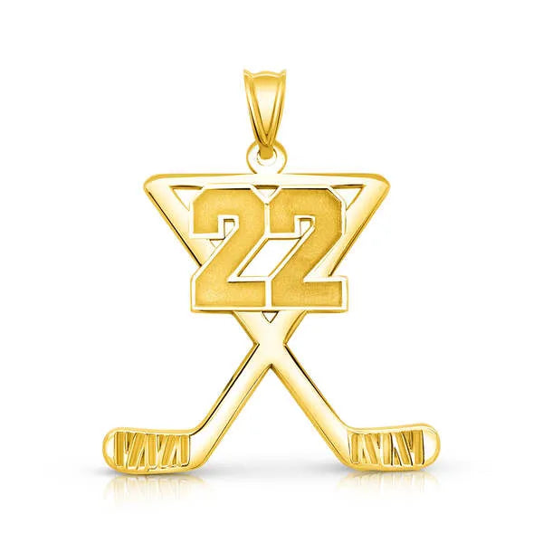 Hockey charm pendant in yellow gold