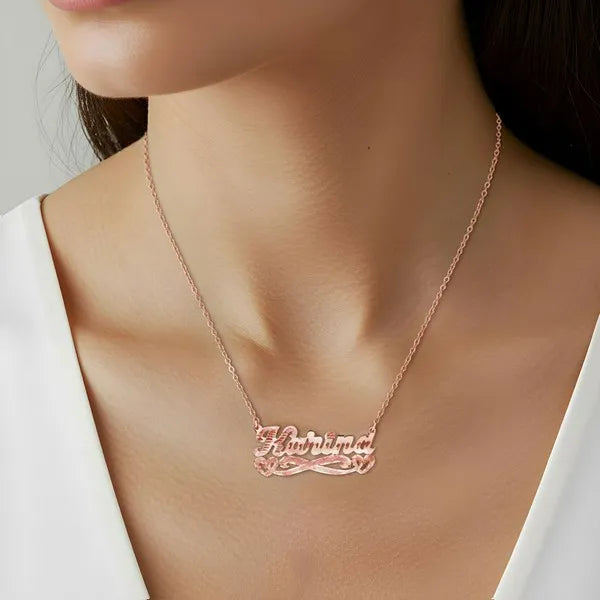 Rose gold Karina florentine name necklace worn on model