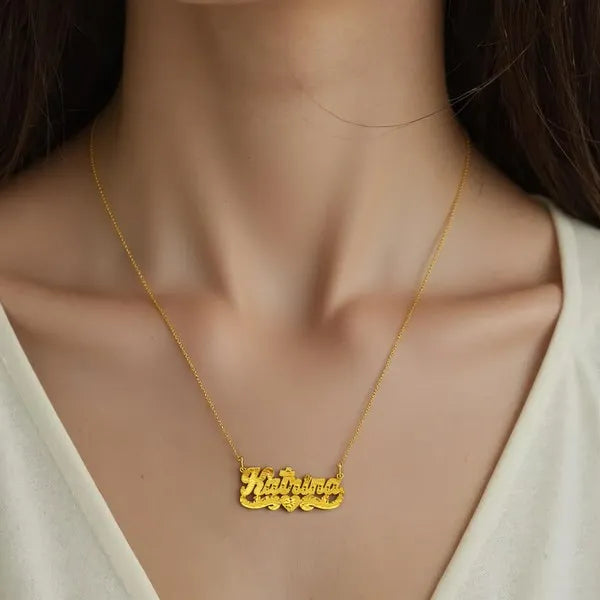 Katrina name necklace worn in 14k yellow gold