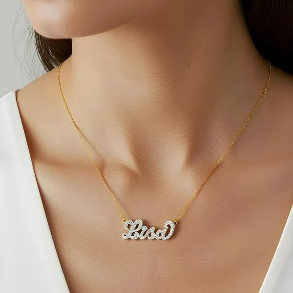 Lisa name necklace worn in 14k yellow gold