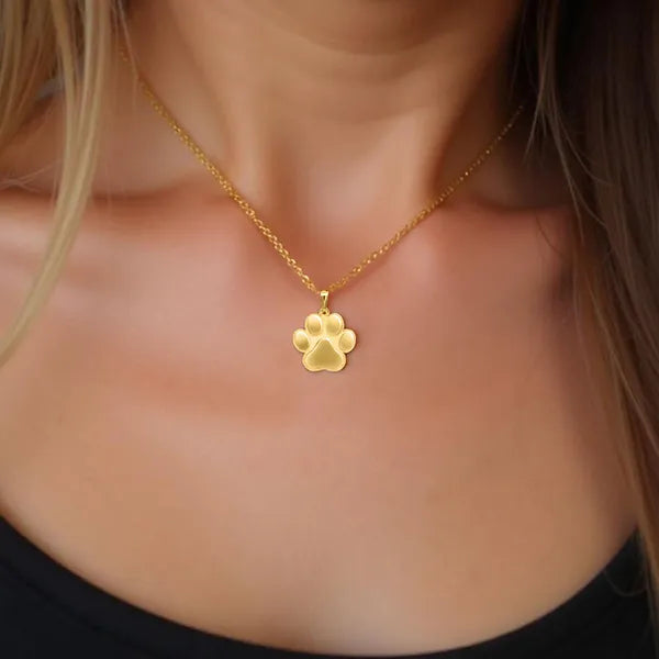 Model display of personalized paw print pendant yellow gold
