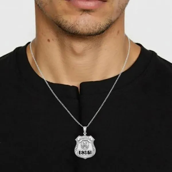 Police badge charm pendant worn by man model in sterling silver