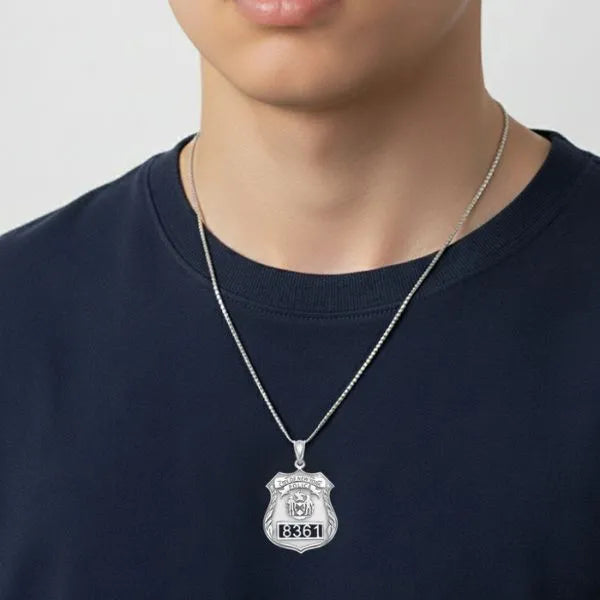 White gold police badge pendant worn by teen