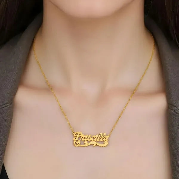 Model showcasing Priscilla diamond cut name necklace yellow gold