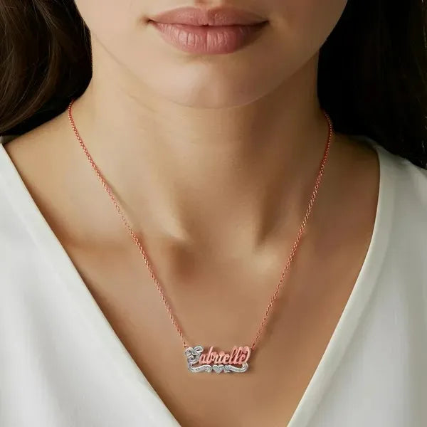 Rose gold name necklace with heart worn on model
