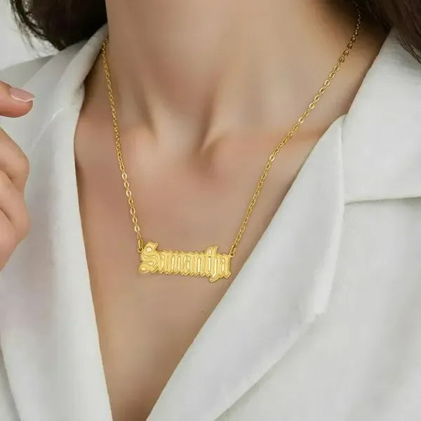 Samantha gothic name necklace worn in 14k yellow gold