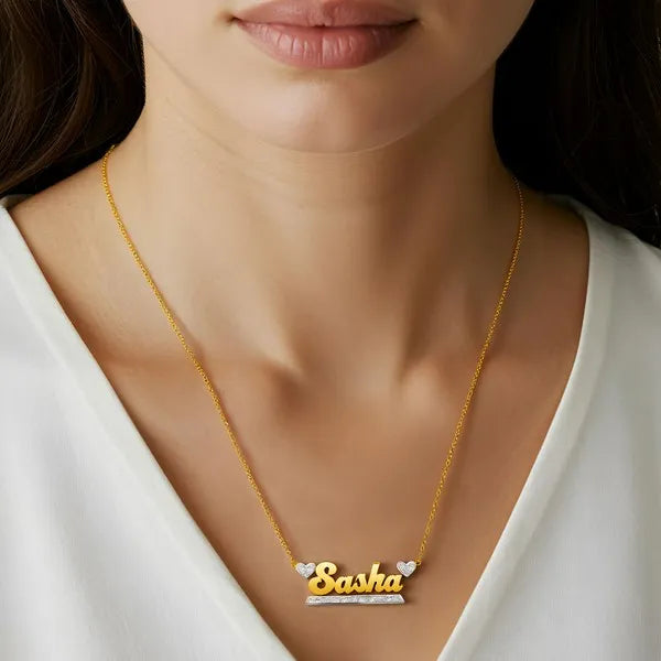 Sasha name necklace worn in 14k yellow gold
