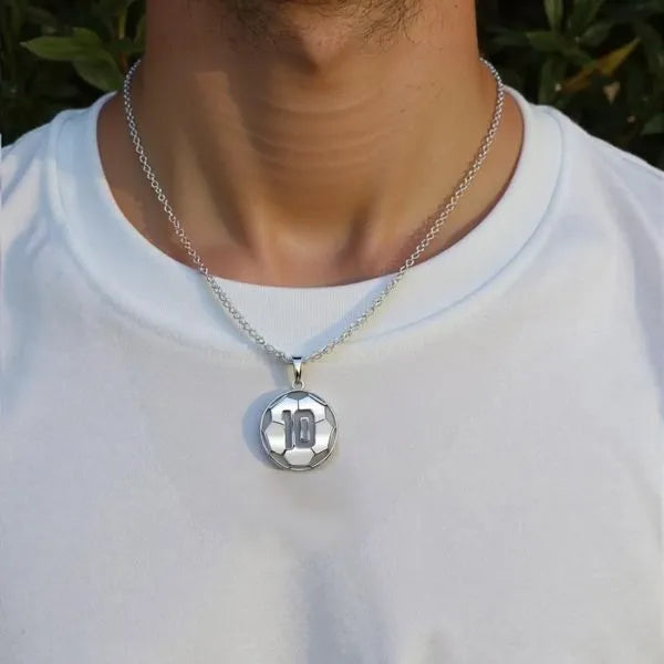 Soccer ball pendant worn by man in sterling silver