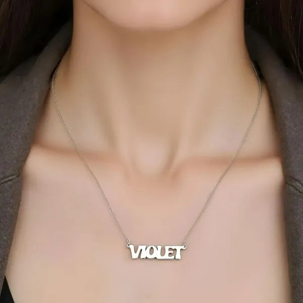 Necklace with 'VIOLET' pendant on a mannequin